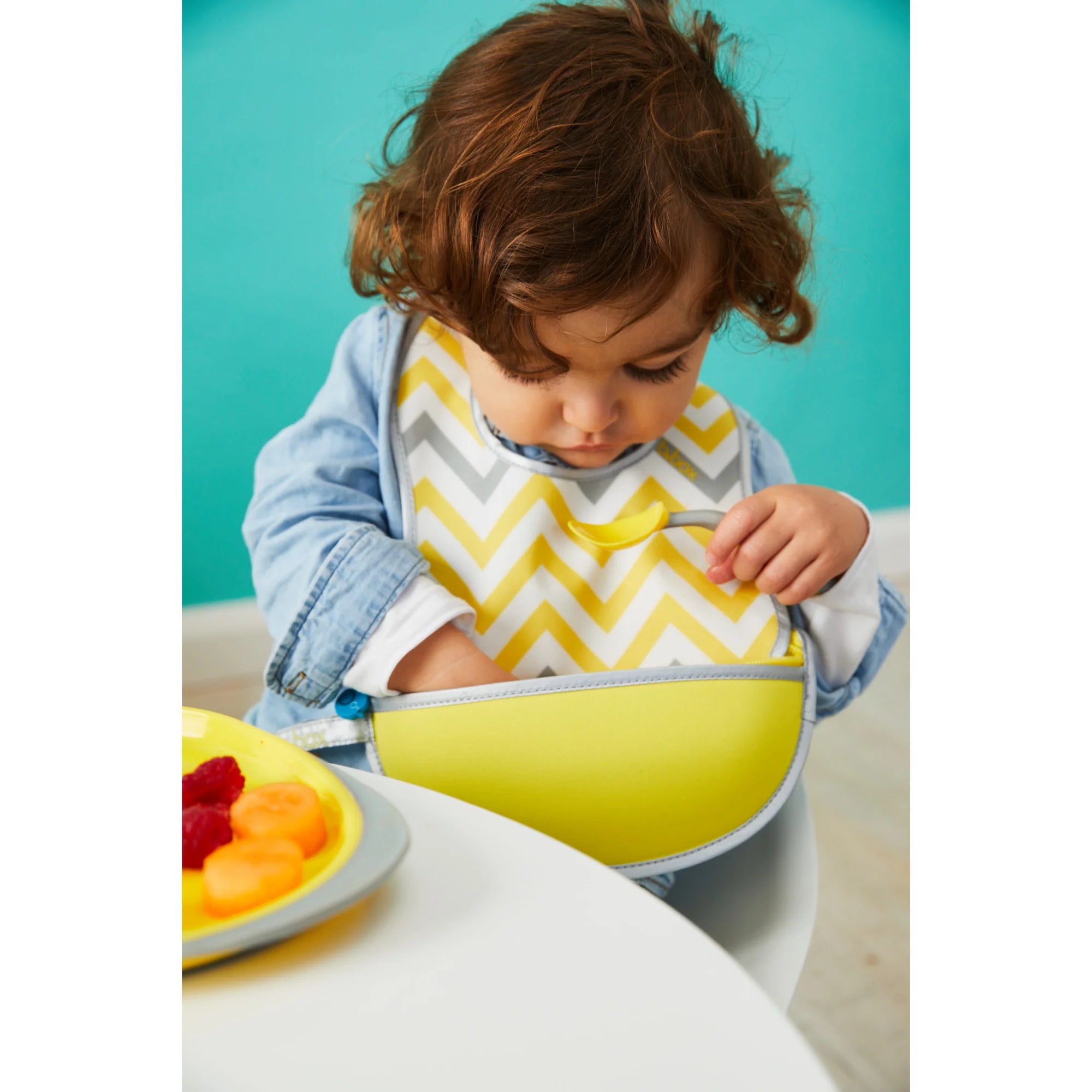 B.box Travel Bib + Flexible Spoon – Mellow Lellow